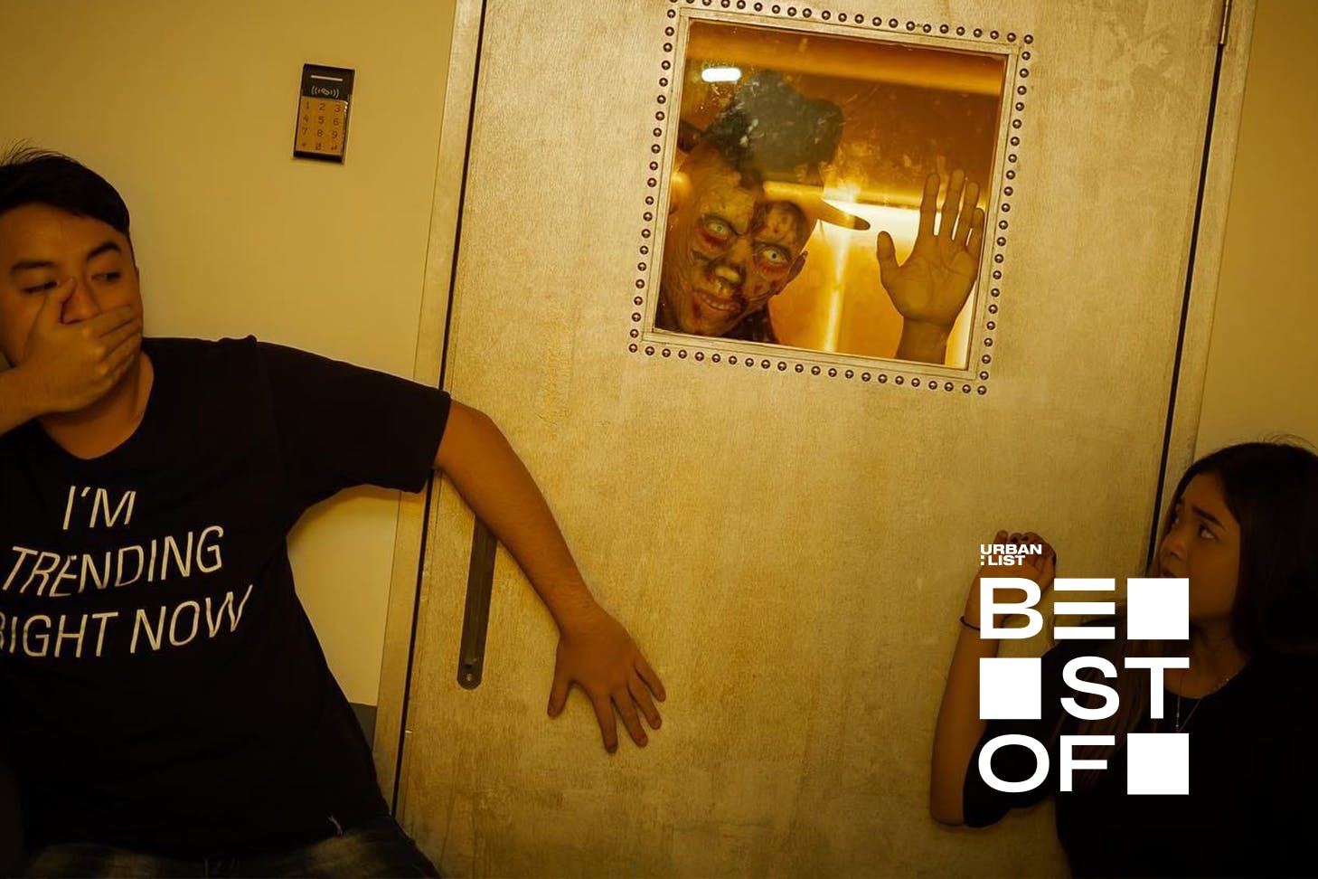 People attempting an escape room at Xcape